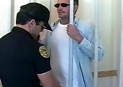 Cop and prisoner exchange blowjobs in the prison cell