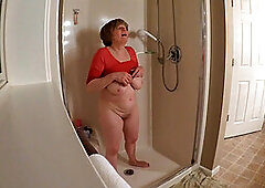 60 GILF masturbating in wet t-shirt