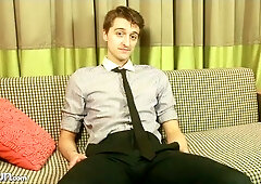 Suave business guy Scott Anders jerks off on a couch