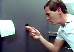 Swallowing cum through the gloryhole