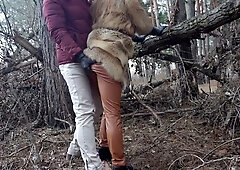 Blonde in fur and leather spreads bare in winter forest during risky outdoor encounter